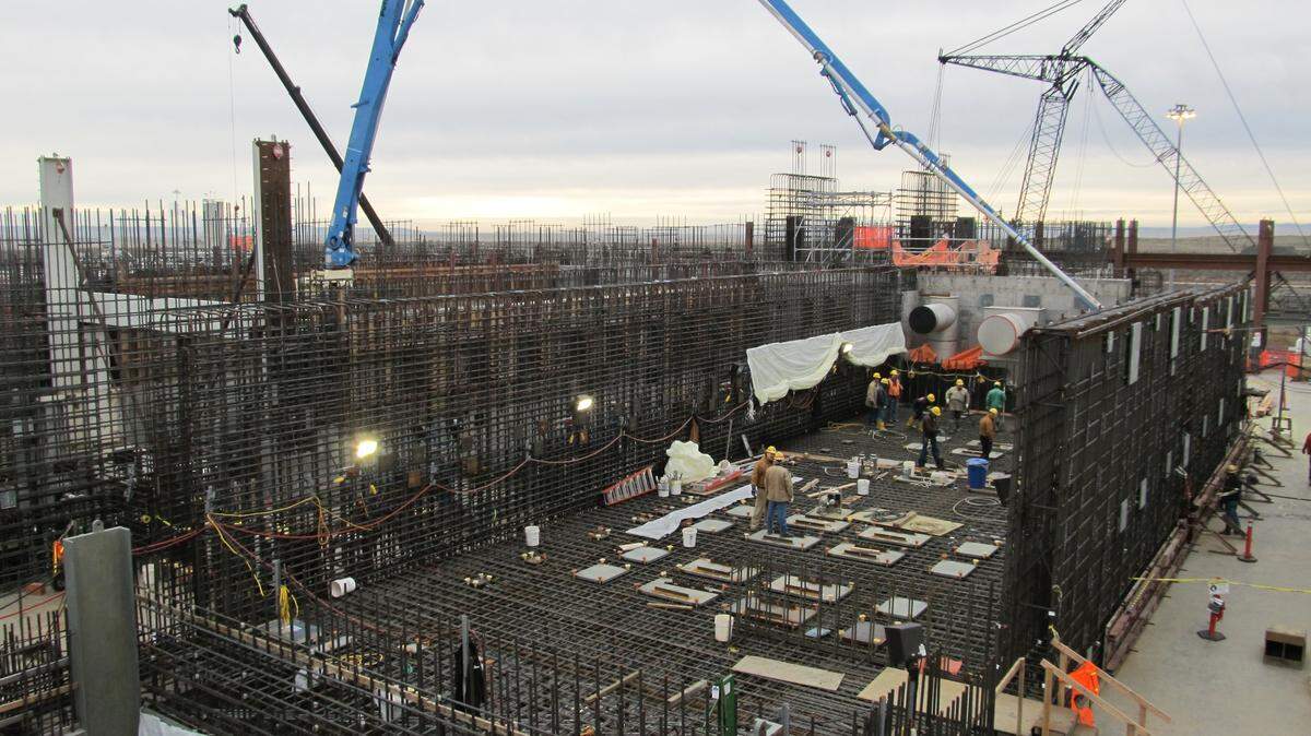 A concrete pump arm pours concrete at the High-Level Waste Facility in December 2012.