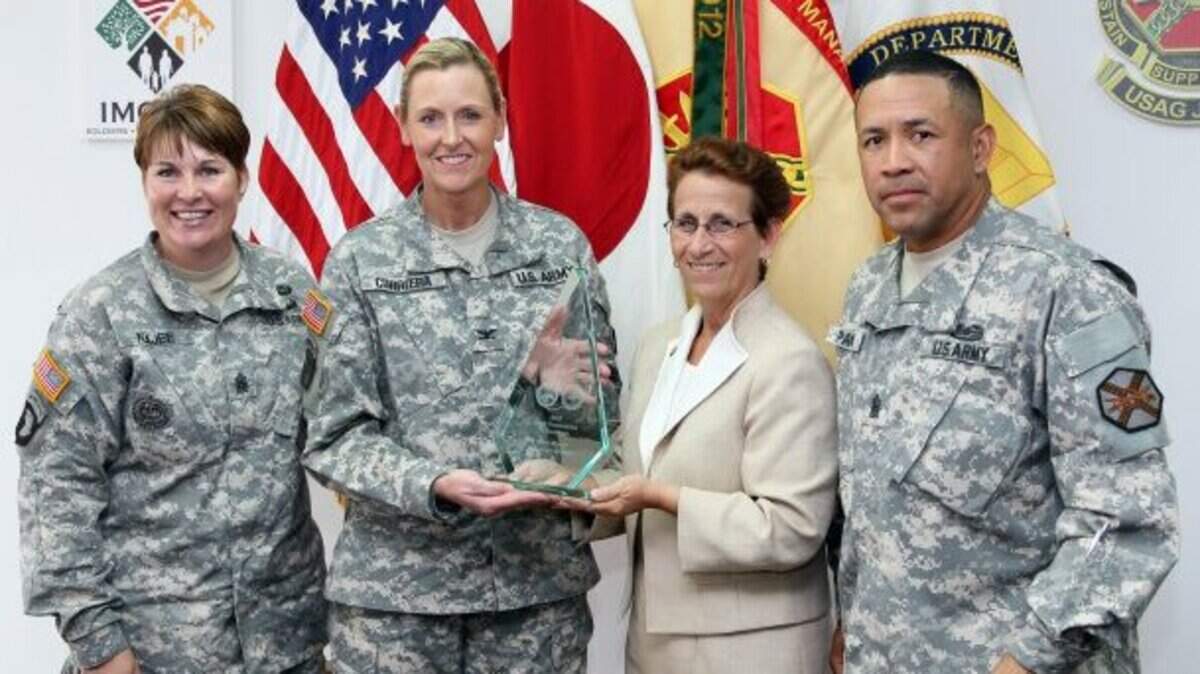 Army Garrison Japan is awarded the silver Army Communities of Excellence award June 24 during a small ceremony. The award was presented to Pasco native then-Col. Joy L. Curriera (second from left), the acting garrison commander. Also in the photo is Command Sgt. Maj. Katrina M. Najee, garrison command sergeant major; Debra D. Zedalis, IMCOM Pacific regional director; and Command Sgt. Maj. Phillip D. Pandy, IMCOM Pacific Regional command sergeant major. Curriera was promoted to brigadier general last summer.