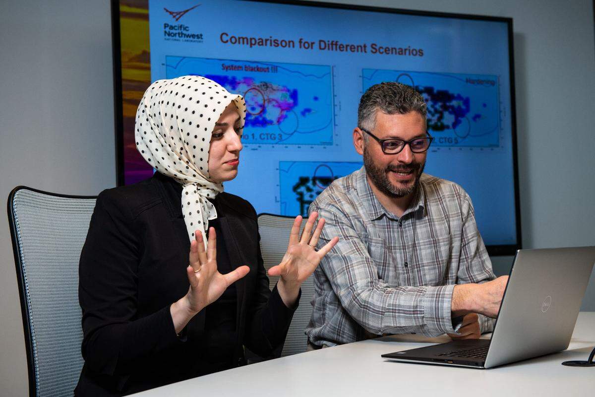Electrical engineers Sarah Davis and Marcelo Elizondo use the Dynamic Contingency Analysis Tool (DCAT), software developed by PNNL that analyzes extreme events, evaluates contingencies and provides grid operators with recommended corrective actions to avoid system failures.