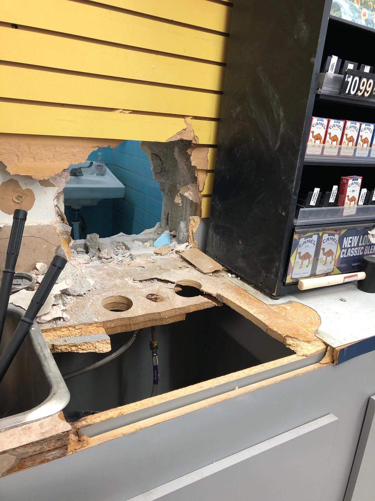 A burglar broke into a Kennewick store through the wall of what appears to be a bathroom.
