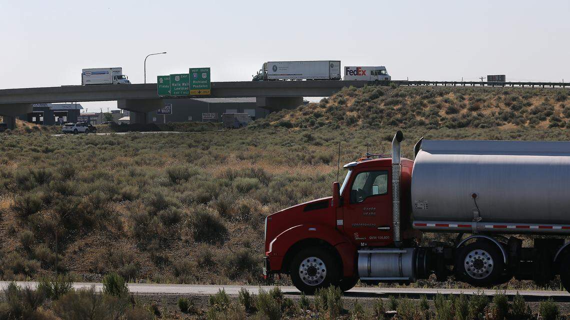 Trucks and other freeway traffic navigates in the Kartchner interchange area on Highway 395 in Pasco. Two developers want to bring new truck stops to the same area.
