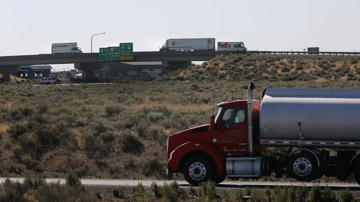 Trucks and other freeway traffic navigates in the Kartchner interchange area on Highway 395 in Pasco. Two developers want to bring new truck stops to the same area.