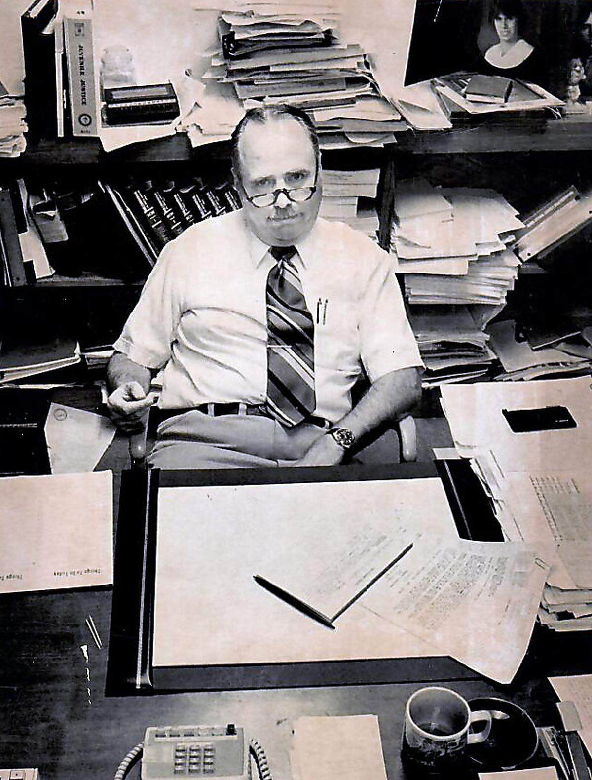 Franklin County Prosecutor Jim Rabideau at his office desk in Pasco.