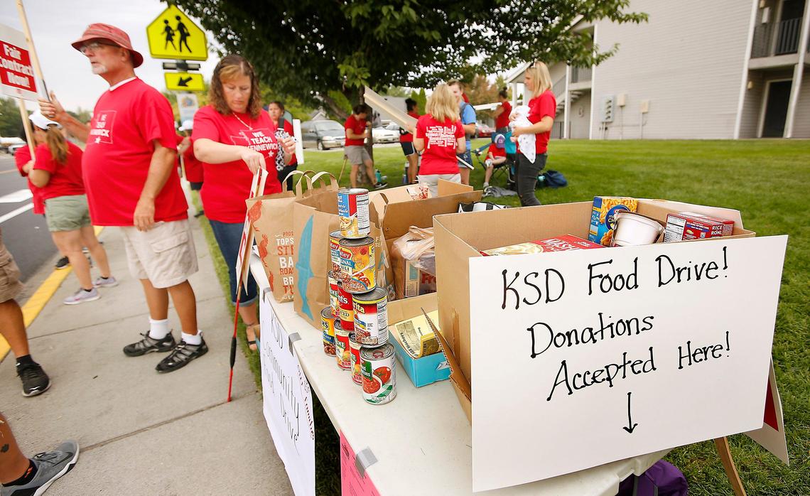 Striking Kennewick teachers from Park Middle School collect donations for a community food drive Thursday at their rally location on West 10th Avenue in Kennewick. Watch a video: tricityherald.com/video