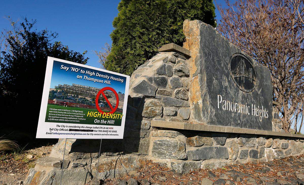 The Panoramic Heights Homeowners Association is opposing the proposed high density residential development of about 40 acres along the top of Thompson Hill in Kennewick. The association created yard signs depicting the proposed area with a photo of buildings added to the hillside.