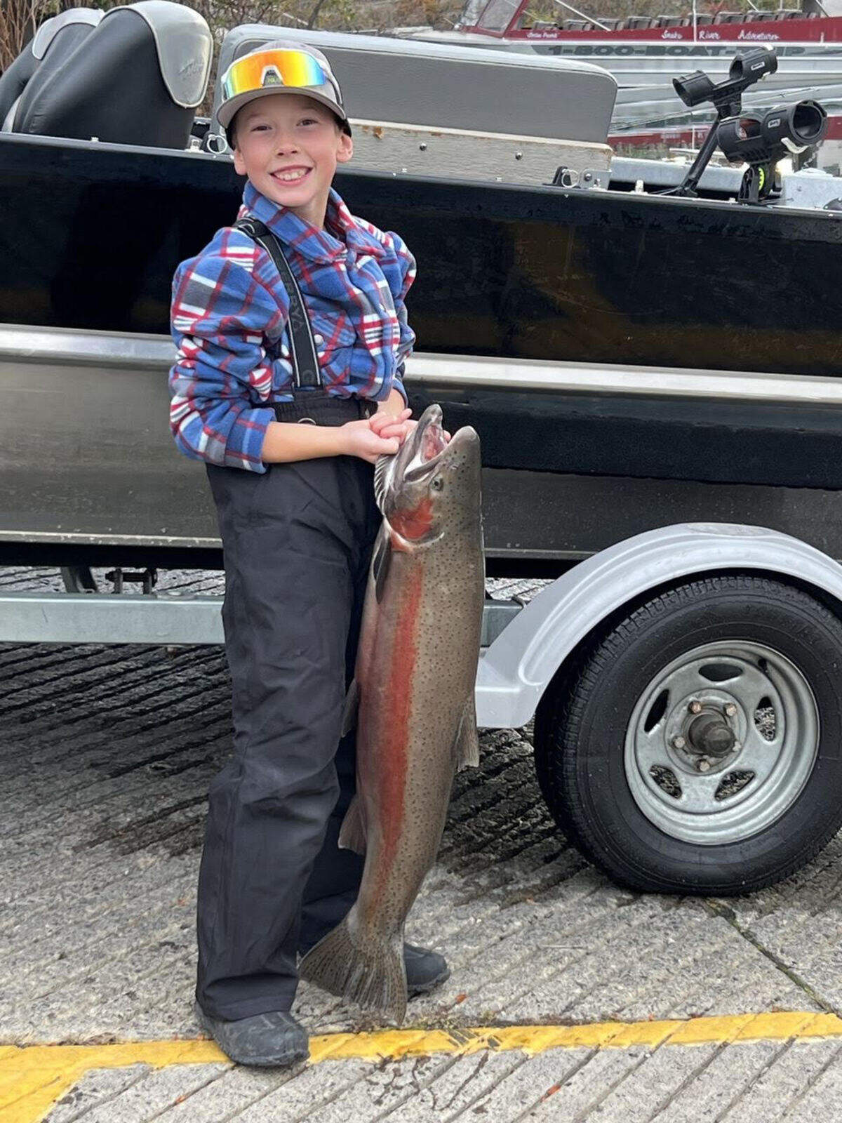 Spiritual Life writer Lee Walter’s grandson holding one of several fish he caught. The day also included his grandson giving grandfather Lee a tutorial in how to fish.