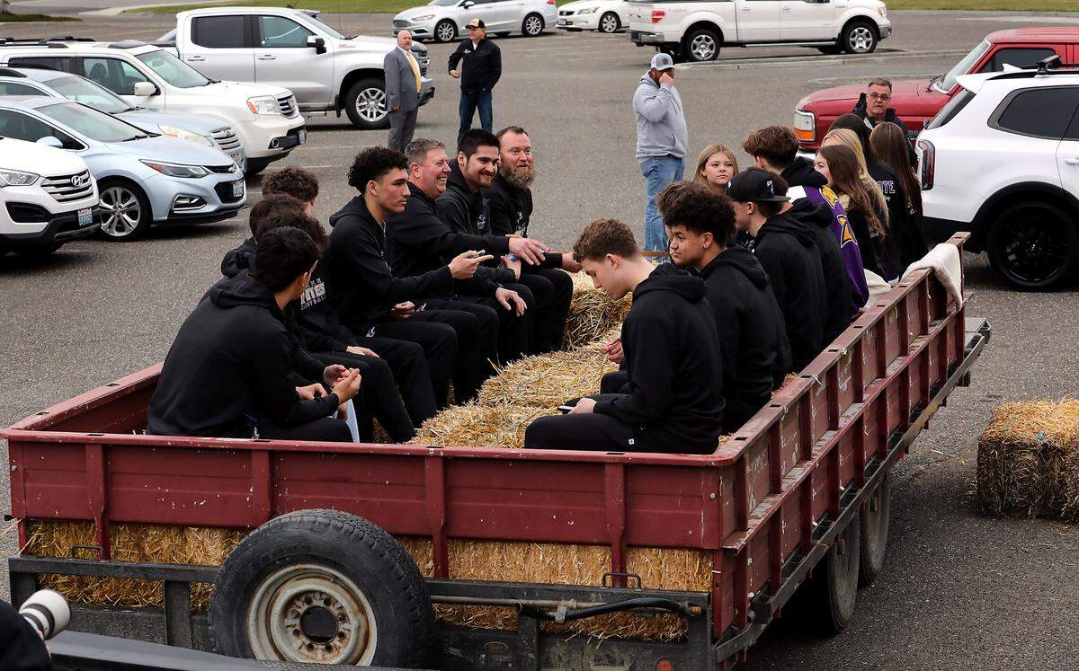 The parade celebrating the Columbia High School boys team state 2B championship prepares to leave the high school parking lot Thursday night in Burbank.