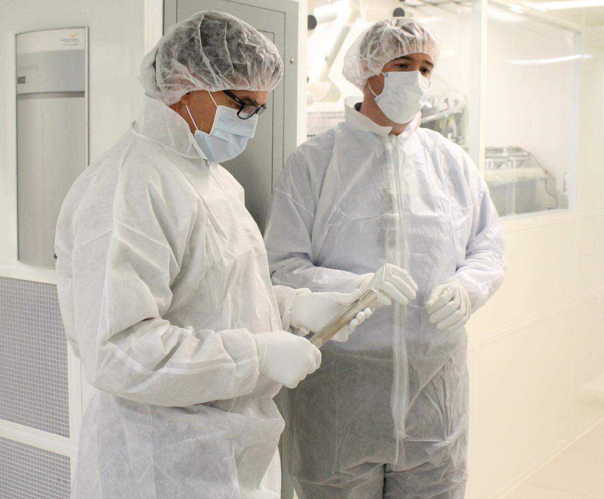 Energy Secretary Rick Perry examines a stainless-steel cylinder on which ultra-pure copper is grown in PNNL's Shallow Underground Laboratory. PNNL Physicist Todd Hossbach explains how this process is used to make some of the world’s most sensitive nuclear detectors.