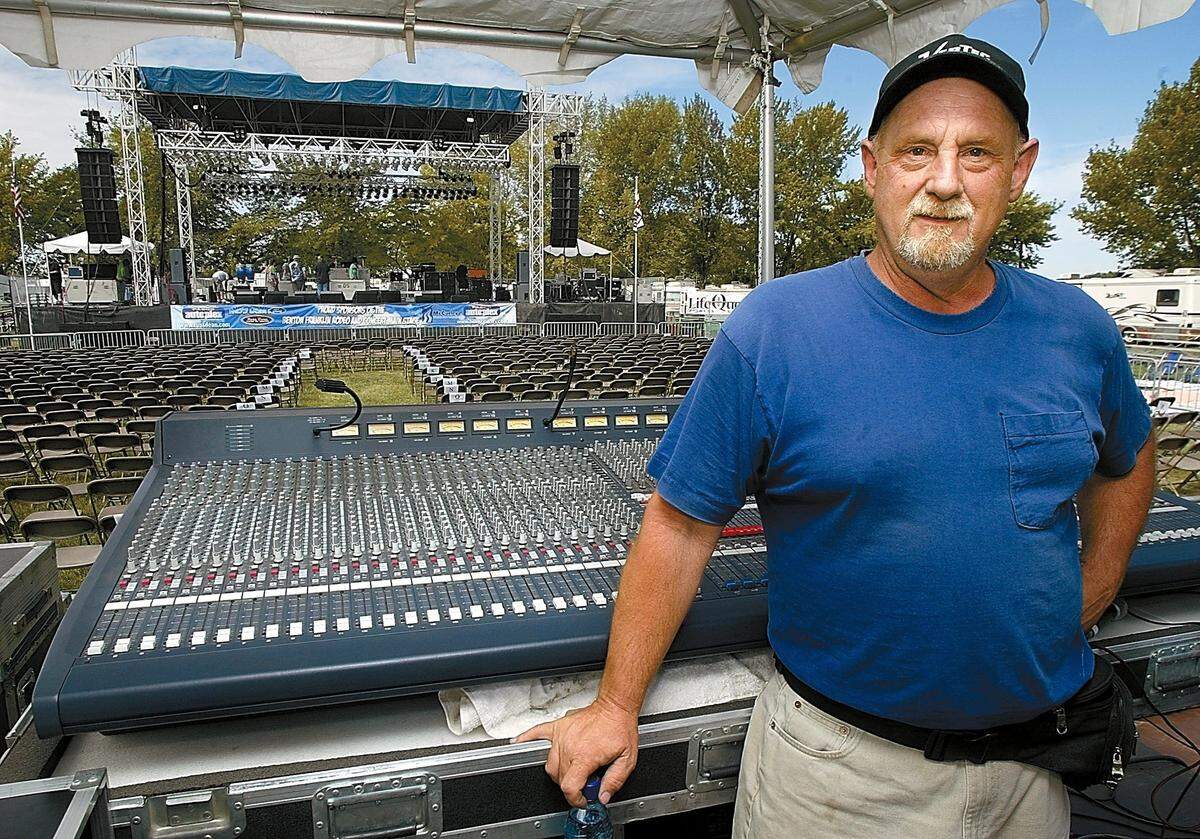 Tom Fortier of Kennewick stands next to the mixing console in 2006 at the Benton Franklin Fair. Fortier has been recognized by the Northwest division of Front of House magazine, receiving the Hometown Heroes award, which is given to sound companies hailed as the best in the business.