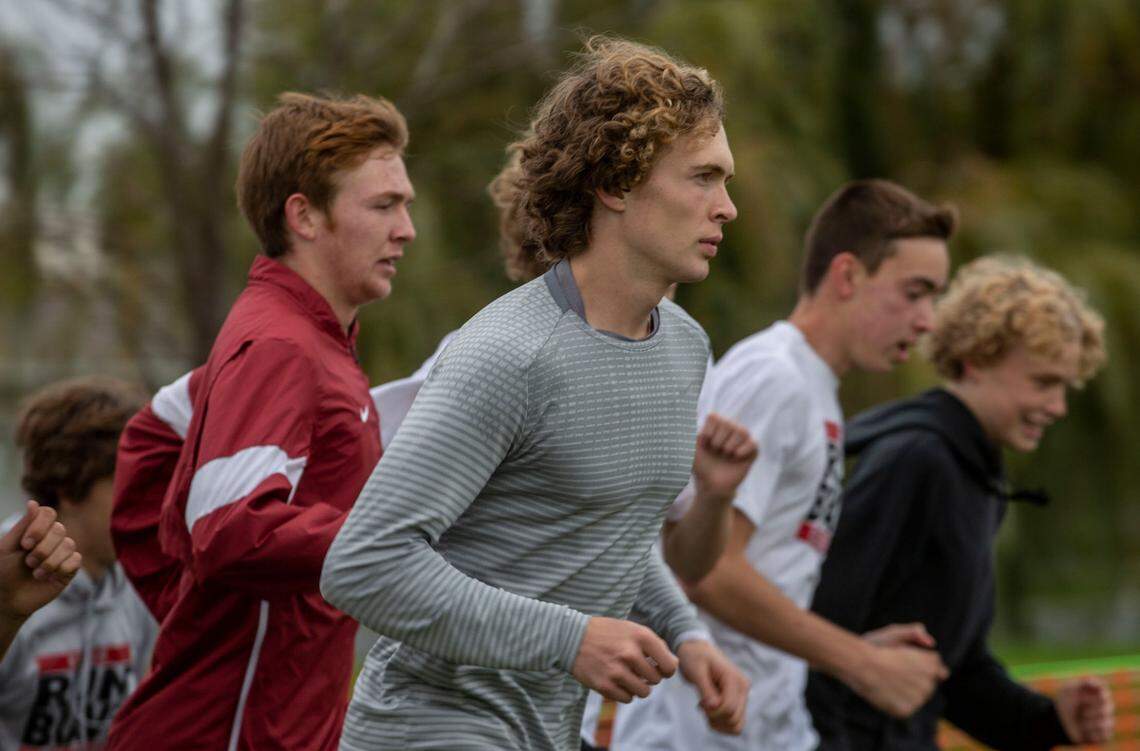 Kamiakin senior Isaac Teeples and the Boys Cross Country team practice for the Washington State Championships at the Sun Willows Golf Course in Pasco.