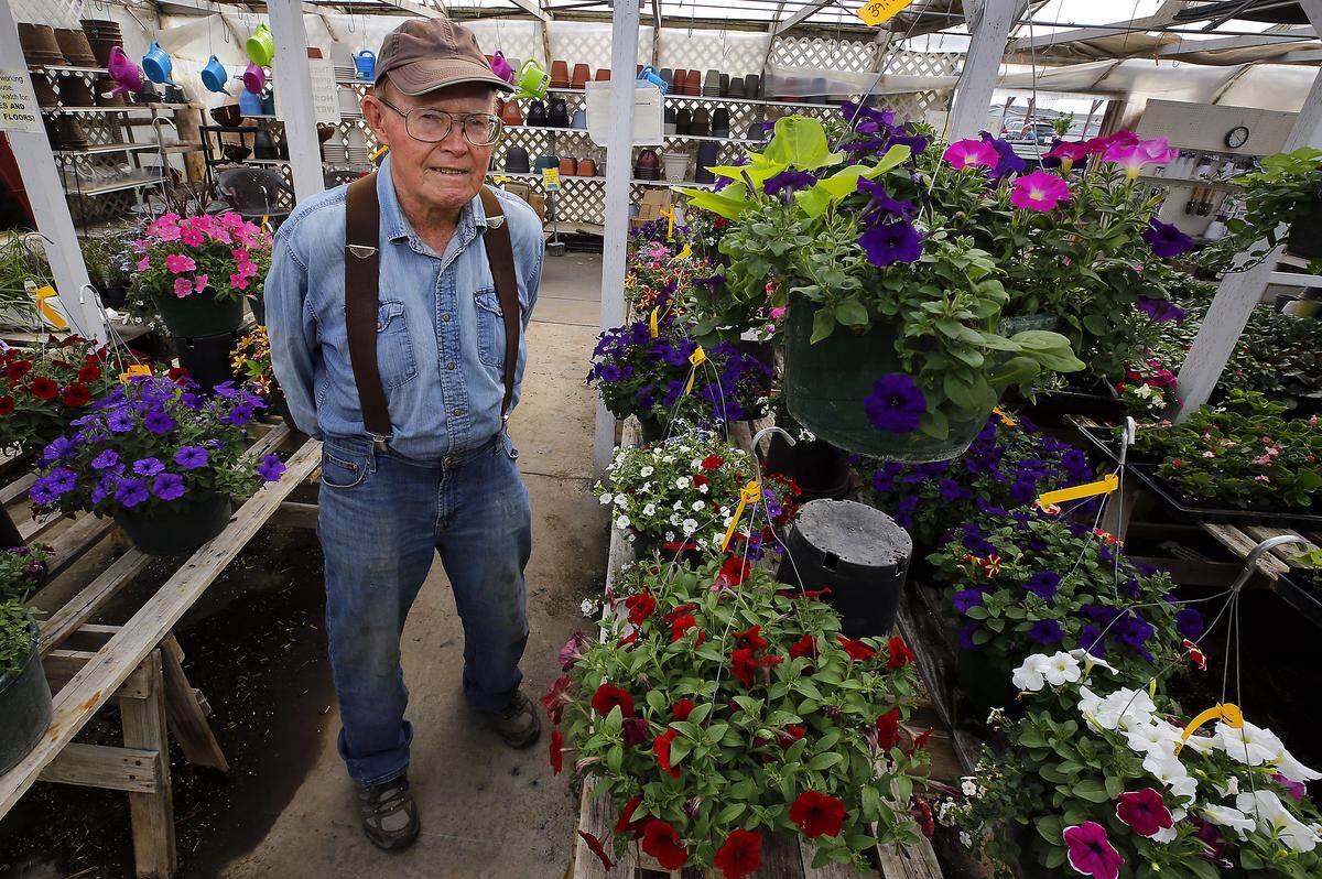 Owner Tom Kay stands inside the Flower Farm at in Kennewick. The longtime garden center business recently announced its pending closure after losing its lease.