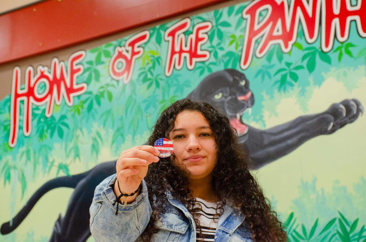 River View High School sophomore Neydin Padilla shows off the sticker design that won Benton County Auditor’s Office’s “I Voted” contest.