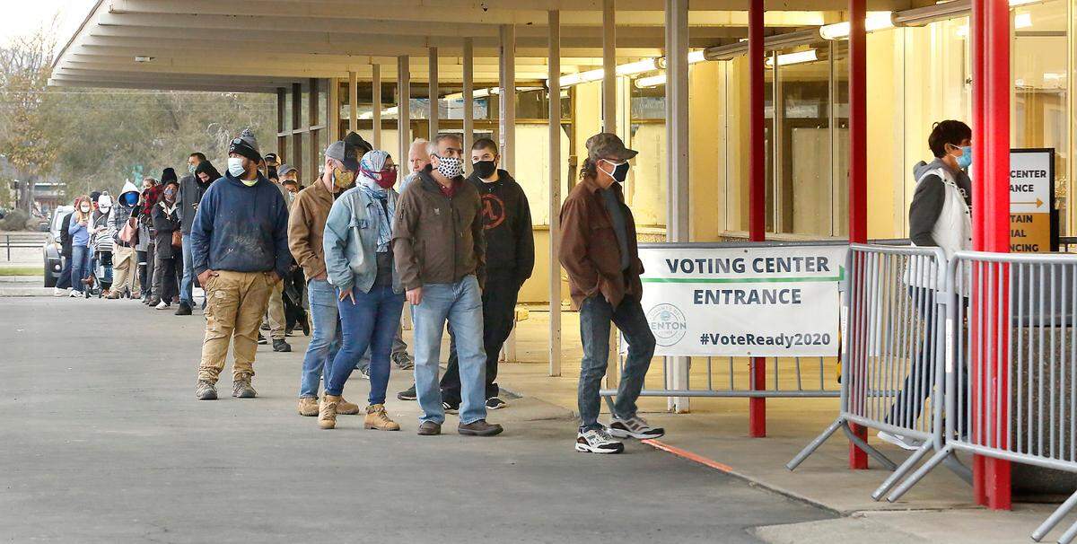 The line of people waiting at the Benton County Voting Center on North Columbia Center Boulevard in Richland late Tuesday afternoon stretches around the front and west side of the building.