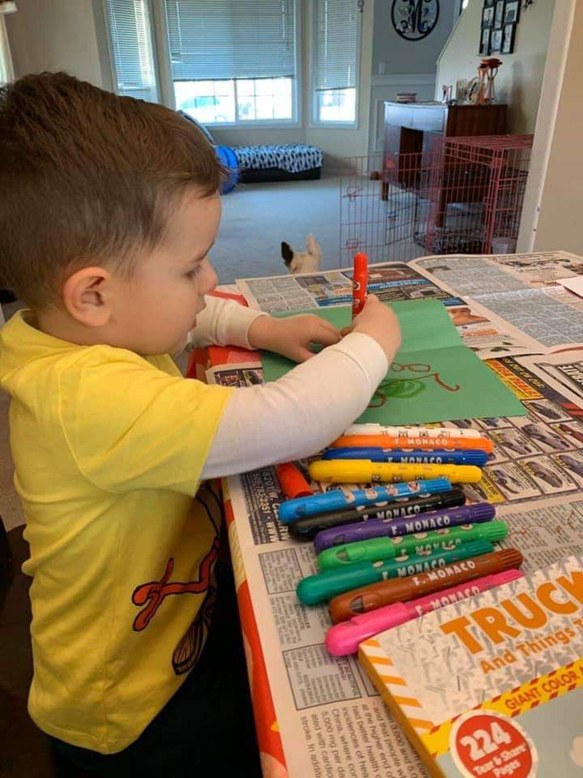 Three-year-old Bradley Yeater makes cards to distribute to patients in Nuclear Care Partners home care, where his grandmother Ricki Pederson, is a community outreach manager.