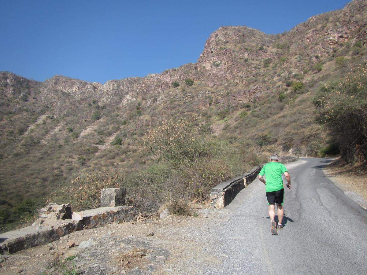 Micah Smith runs Bansdara Peak, India, to reach Monsoon Palace perched at 3,100 feet.