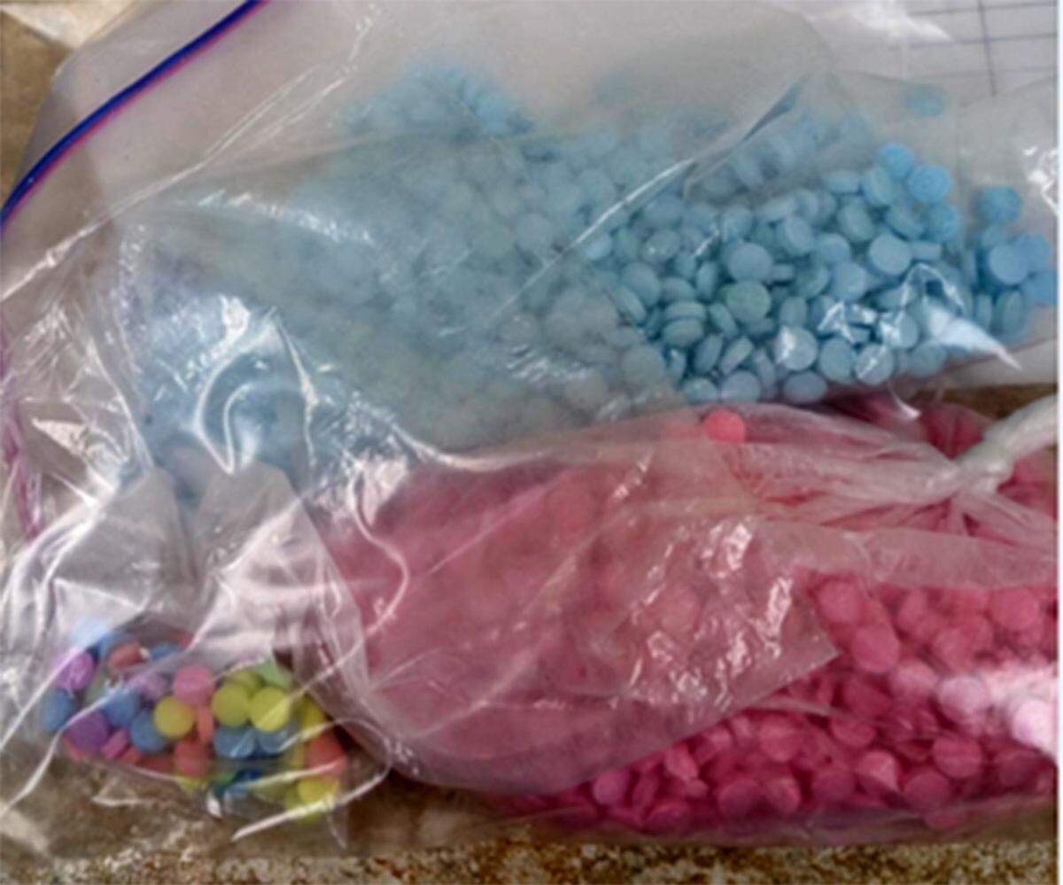 Fentanyl-laced pills, including pink and rainbow-colored pills, seized by the Southeast Washington Safe Streets Task Force in December 2022.
