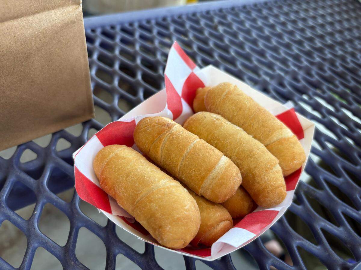 An order of tequeños from Antojos 509 comes with eight sticks and a dipping sauce. The snack is a Venezuelan cheese stick traditionally made with wheat flour.