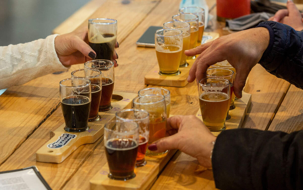 Patrons share flights at Moonshot Brewery in Kennewick.