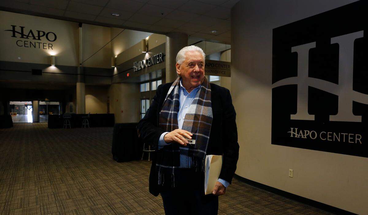 Larry Leasure of HWL Management stands in the atrium near the offices for the HAPO Center in Pasco in 2023.