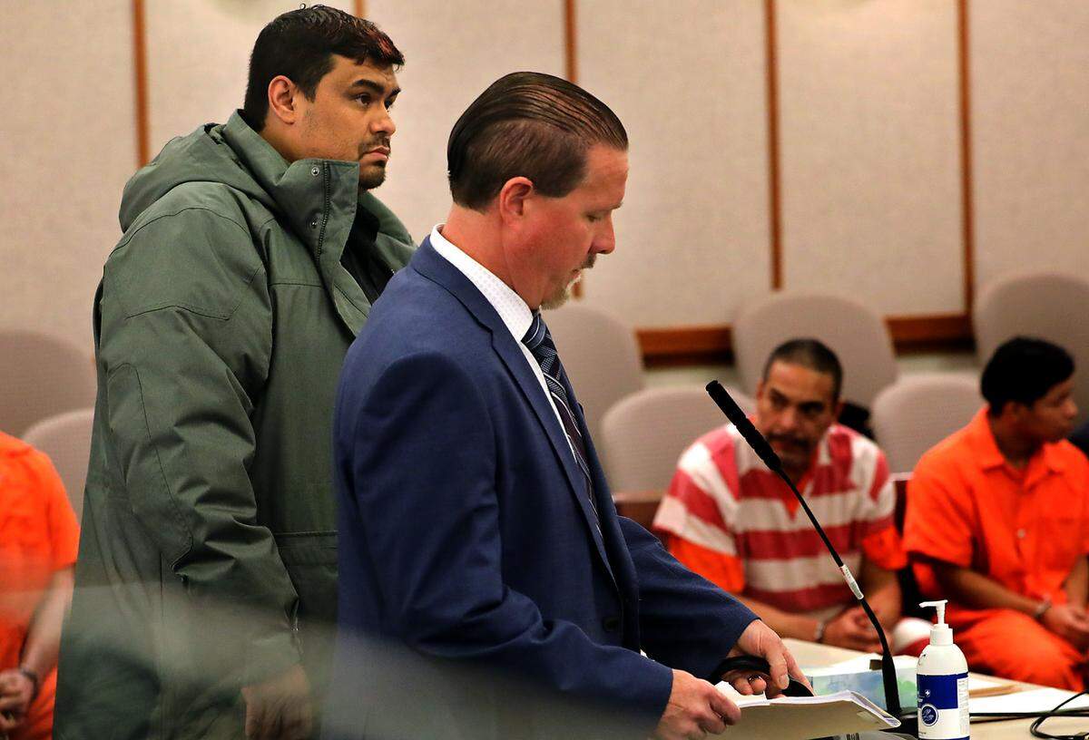 Justin Hernandez, left, makes his initial appearance in Franklin County Superior Court with his defense attorney Randall Jameson. The former Tri-City Animal Shelter employee is charged with multiple counts of animal cruelty.