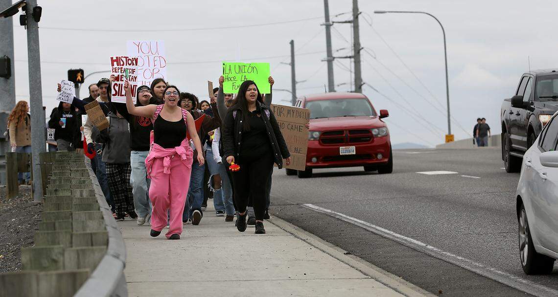 High school students walk eastbound on  West Court Street at North 32nd Avenue Friday afternoon during a protest march in Pasco.