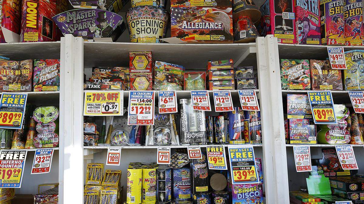 TNT Fireworks fill the shelves of the stand owned and operated by Jehiely Cook and her husband, Joshua, for New Year's sales in the parking lot of the Safeway grocery store at the corner of West Clearwater Avenue and North Edison Street in Kennewick.