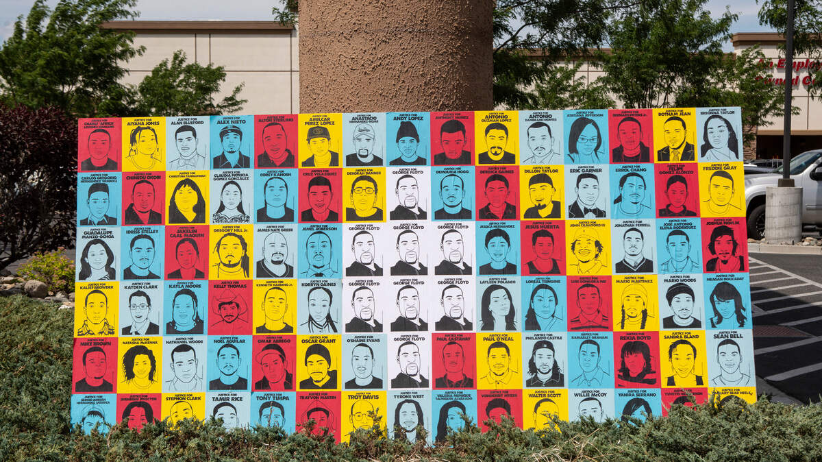 Pictures of victims of police brutality and racial violence are displayed outside of WinCo on West Clearwater Avenue in Kennewick during a Black Lives Matter demonstration on Saturday.