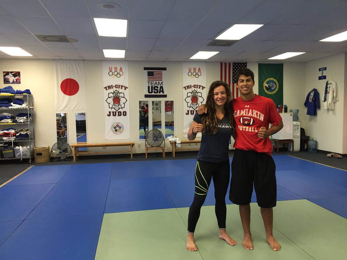 Miesha Tate, pictured in 2015 with then-Kamiakin High quarterback Zach Borisch at Tri-City Judo, used to live in Richland with longtime boyfriend and fellow MMA fighter Bryan Caraway.