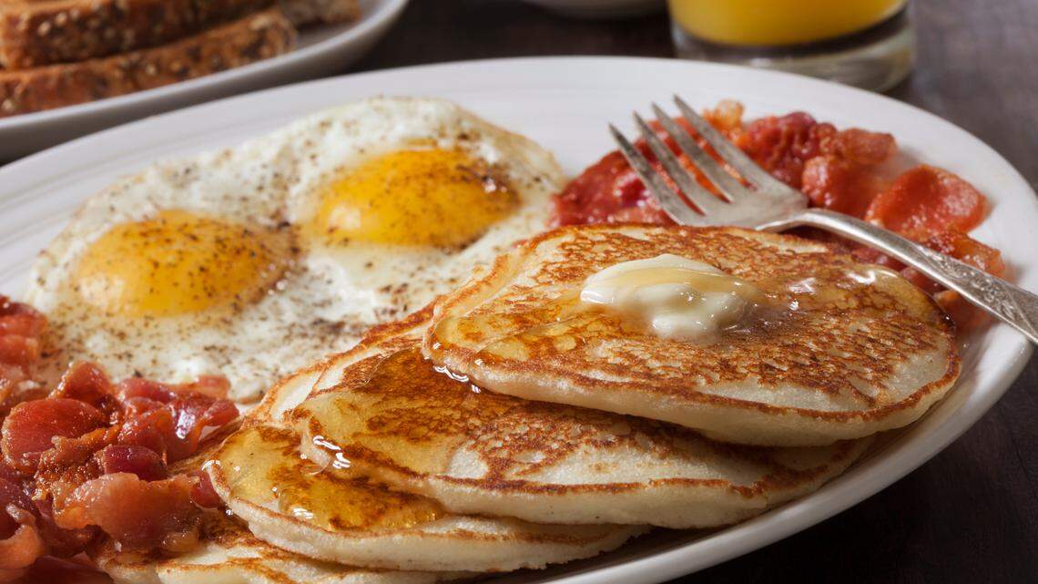 A plate of breakfast food.