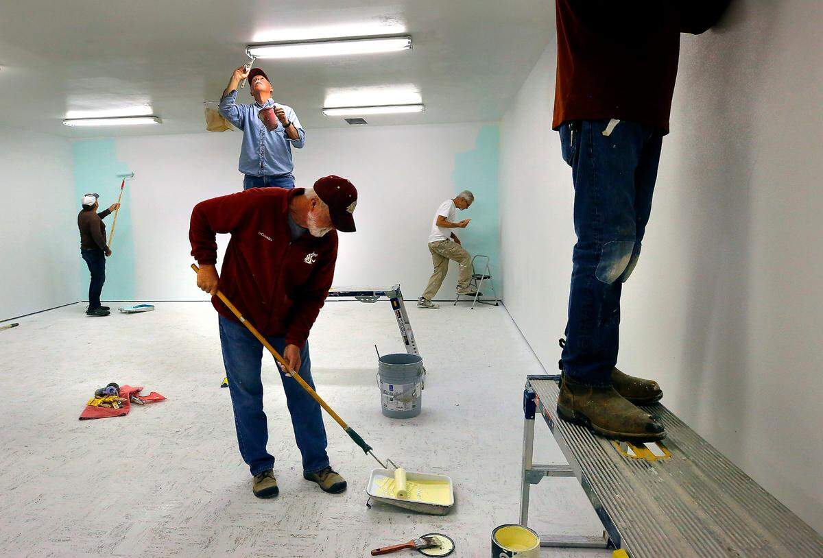 A group of retired volunteers, nicknamed the Handy Helpers, paint the new home of Mirror Ministries, the Christian nonprofit focused on ending sex trafficking of minors in the Tri-Cities.