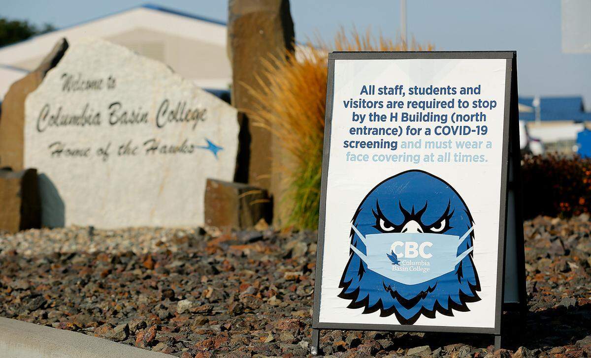 A sign at the North 20th Avenue entrance to the Columbia Basin College campus in Pasco informs staff, students and visitors of the protocols to follow during the ongoing coronavirus pandemic.