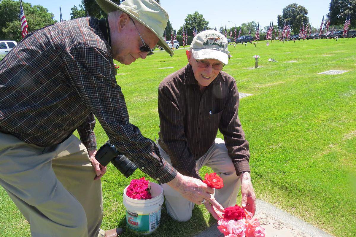 James and Wilburn Coleman placed flowers at the grave of a cousin buried at Sunset Gardens in Richland during Memorial Day. They bring flowers to the cemetery each year.