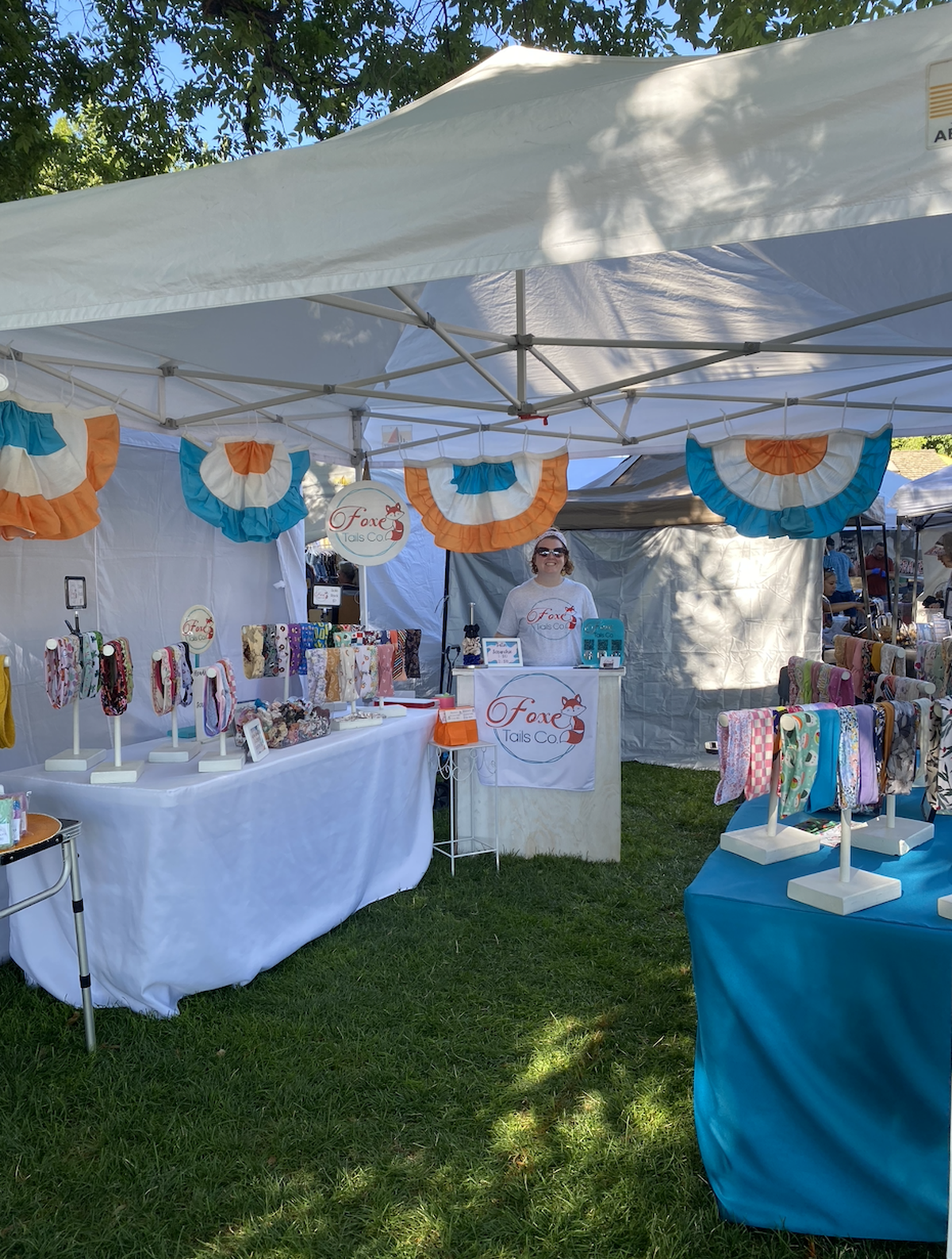 Jenni Foxe, owner of Foxe Tails Co., sells handmade headbands, scrunchies and spa accessories at her Art in the Park booth.