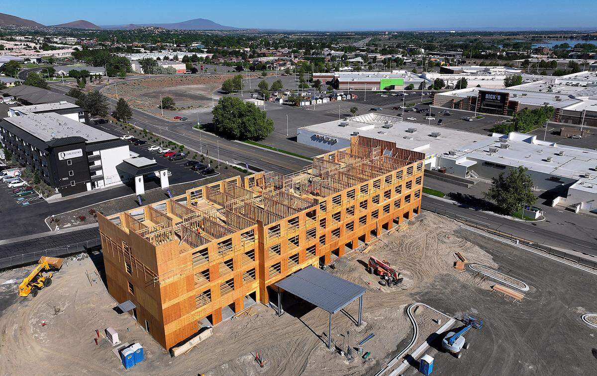Construction crews frame a four-story Holiday Inn Express at 7715 W. Quinault Ave. in Kennewick. 