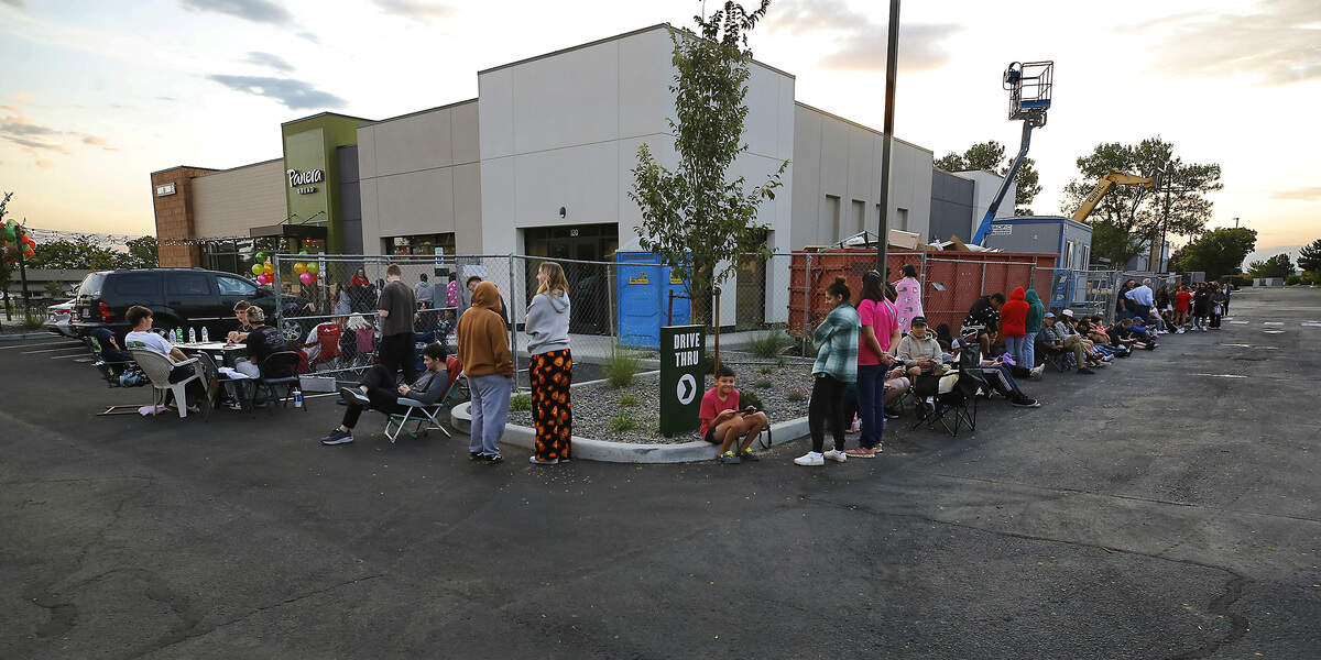 A line of customers stretches through the parking lot and wraps around the building waiting for the new Panera Bread restaurant in Kennewick to open its doors early Thursday morning in Kennewick.