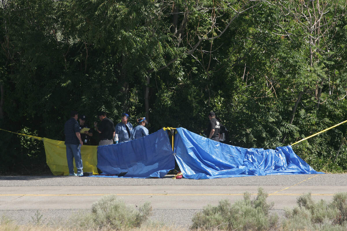 Investigators gather evidence where the body of Araceli Camacho Gomez was found along Columbia Park Trail in Kennewick’s Columbia Park. Kennewick police and the Washington State Patrol Crime Lab are investigating the death determined a baby was cut from her womb.