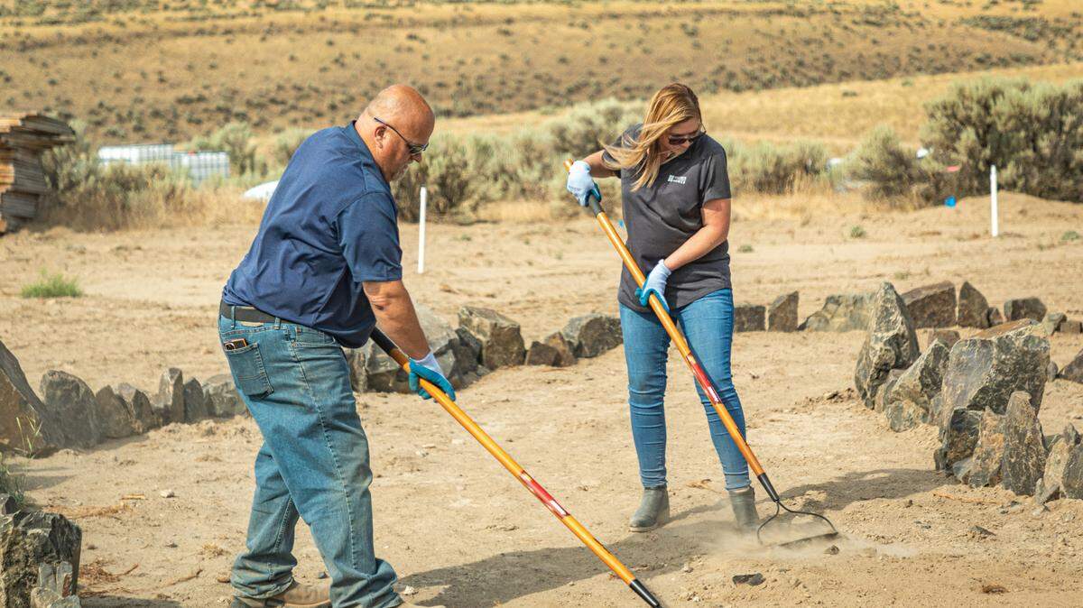 Volunteers with Hayden Homes work on trails and sensory gardens at the Ranch, a planned retreat being built by the Friends of Disabled Veterans.
