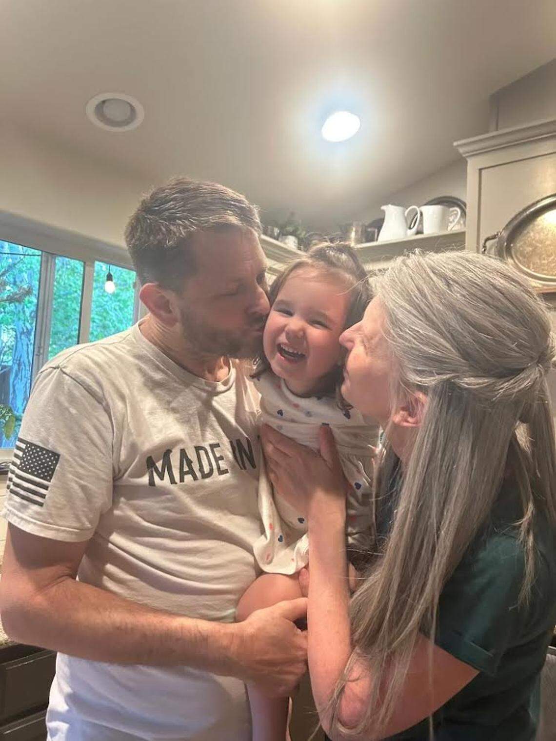 Todd and Wendy Kleppin with a grandchild.