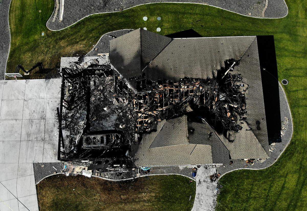 Flames spread through this house on East Grand Bluff Loop in the Rancho Reata area on June 30 in Benton County. First responders from four Tri-Cities agencies helped put out the blaze. The $900,00 home was declared a total loss.