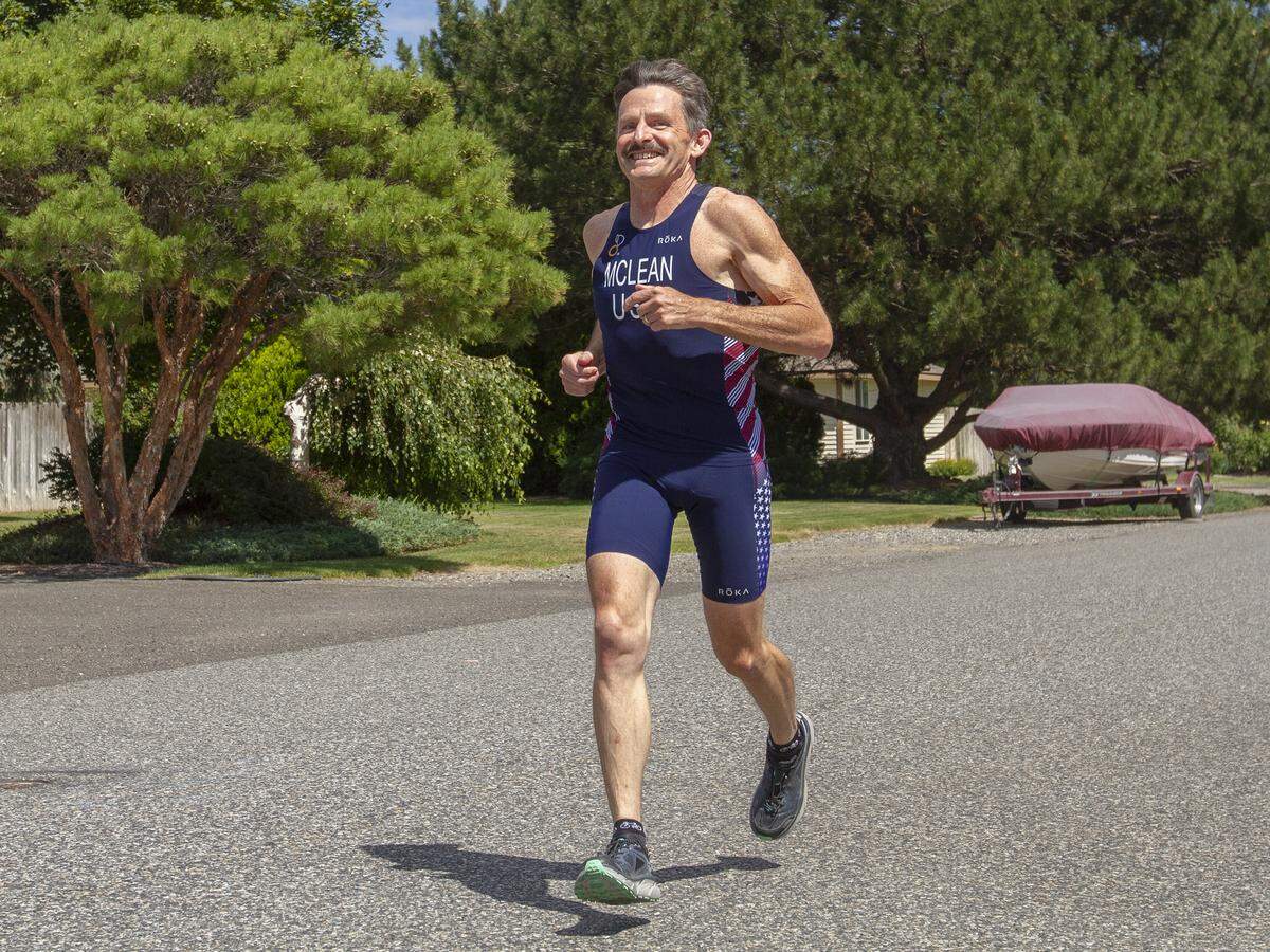 Mark McLean, a retired Battelle engineer from Richland, runs 10 to 15 miles per week, cycles and swims as part of his training.