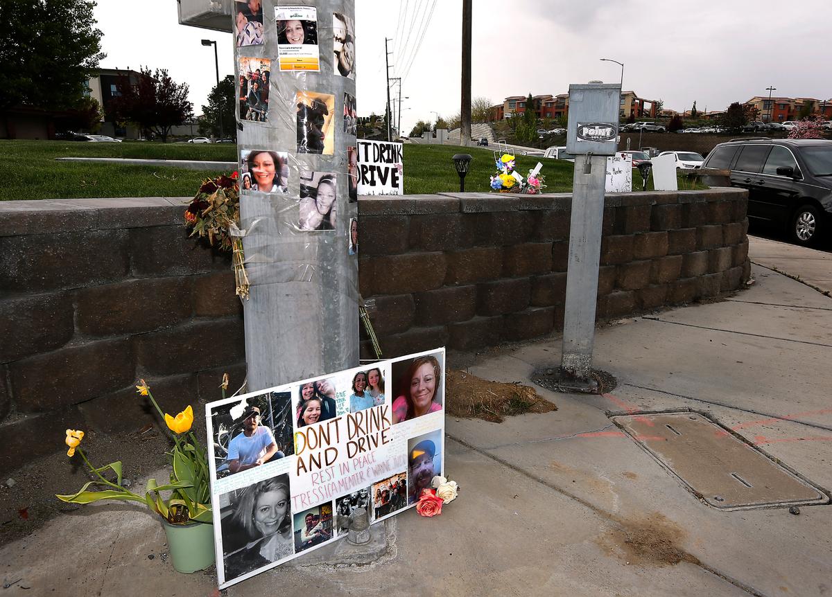 A memorial pays tribute to fatal traffic collision victims Tressica Garza, 38, and Wayne Judd, 45, at the intersection of North Steptoe Street and Gage Boulevard in Kennewick. Kennewick Police say they were driving east on Gage Boulevard on April 3, 2022 when a speeding minivan ran a red light and slammed into their SUV, killing them instantly. The minivan driver Mariana Souza, 28, told police she was racing home from a bar in Richland and remains in jail on investigation of two counts of vehicular homicide.