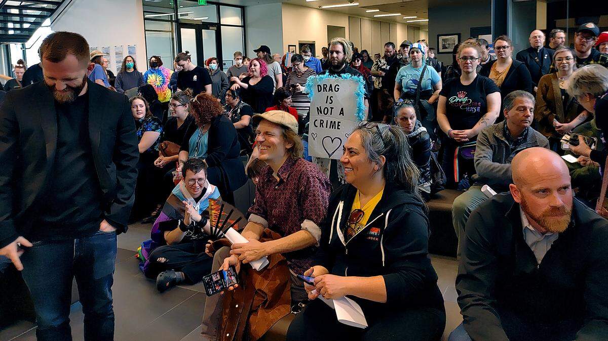 Emerald of Siam owner Dara Quinn, center, and about 150 supporters fill Richland City Hall after marching to the council meeting from the restaurant to address the council about their concerns.