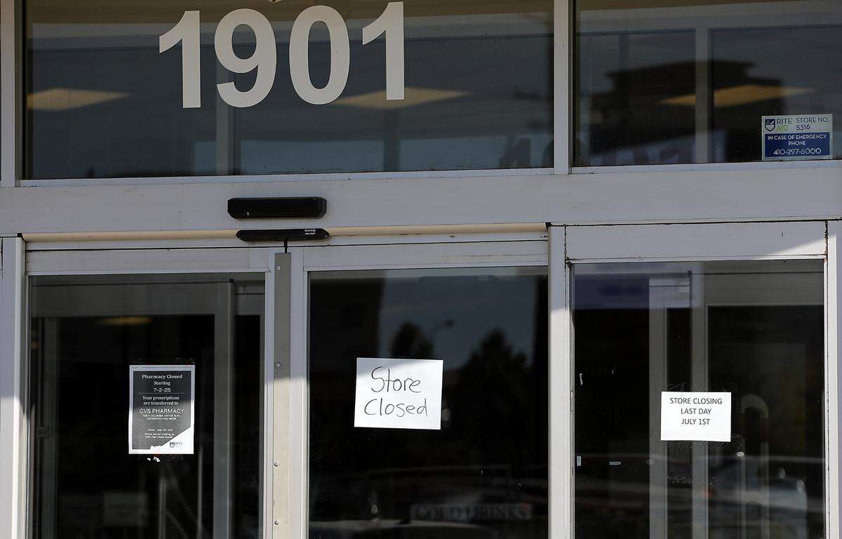 Signs are posted on the main doors of the recently closed Rite Aid Pharmacy on Steptoe Street in Kennewick.