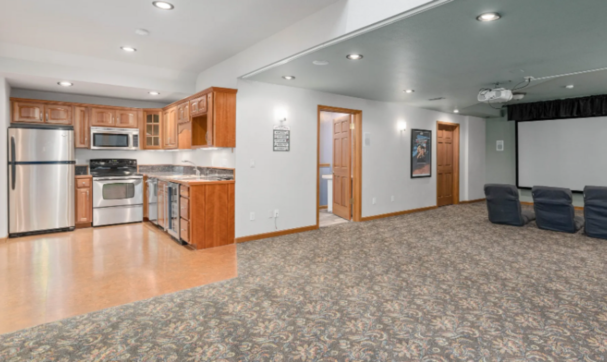 The custom built home features an indoor theater area.