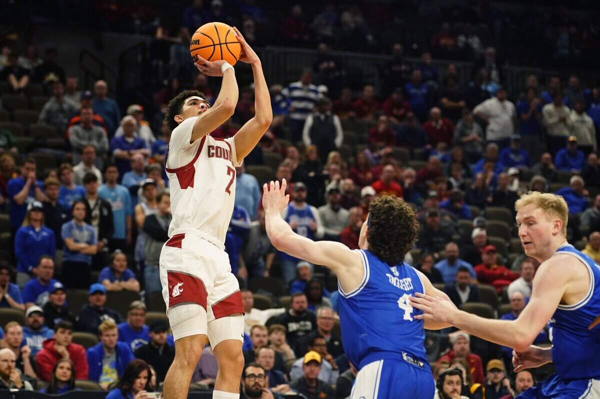 Mar 21, 2024; Omaha, NE, USA; Washington State Cougars guard Myles Rice (2) shoots against Drake Bulldogs guard Conor Enright (4) in the second half in the first round of the 2024 NCAA Tournament at CHI Health Center Omaha. Mandatory Credit: Dylan Widger-USA TODAY Sports