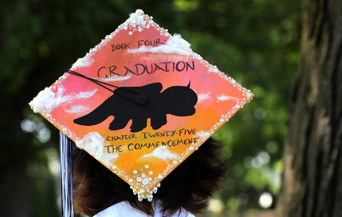 Lena Olsen, a 2025 Three Rivers HomeLink graduate, has her cap decorated for her graduation ceremony.