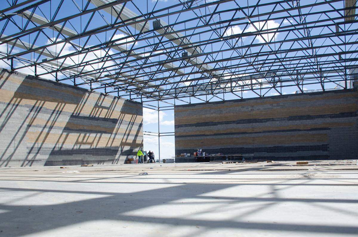 The Sageview High School gymnasium will be home to more than 2,000 seats for its entire student body when it opens in fall 2025. Construction crews just recently installed the roof trusses over the rock enclosure.