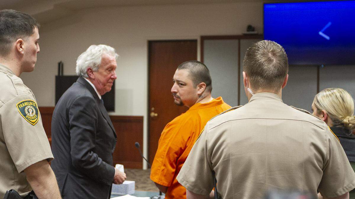 Edwin Espejo looks out to his family after being sentence on Friday at Franklin County Superior Court in Pasco. Espejo was sentenced 70 years after a jury convicted him of trying to kill three officers who responded to a domestic violence call at his home.
