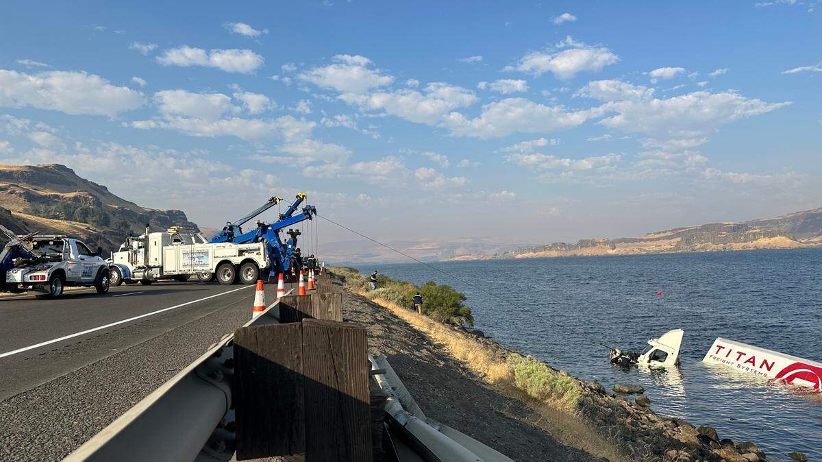 The Oregon State Department of Transportation closed westbound Interstate 84 near Biggs Junction after two semi trucks went into the Columbia River.