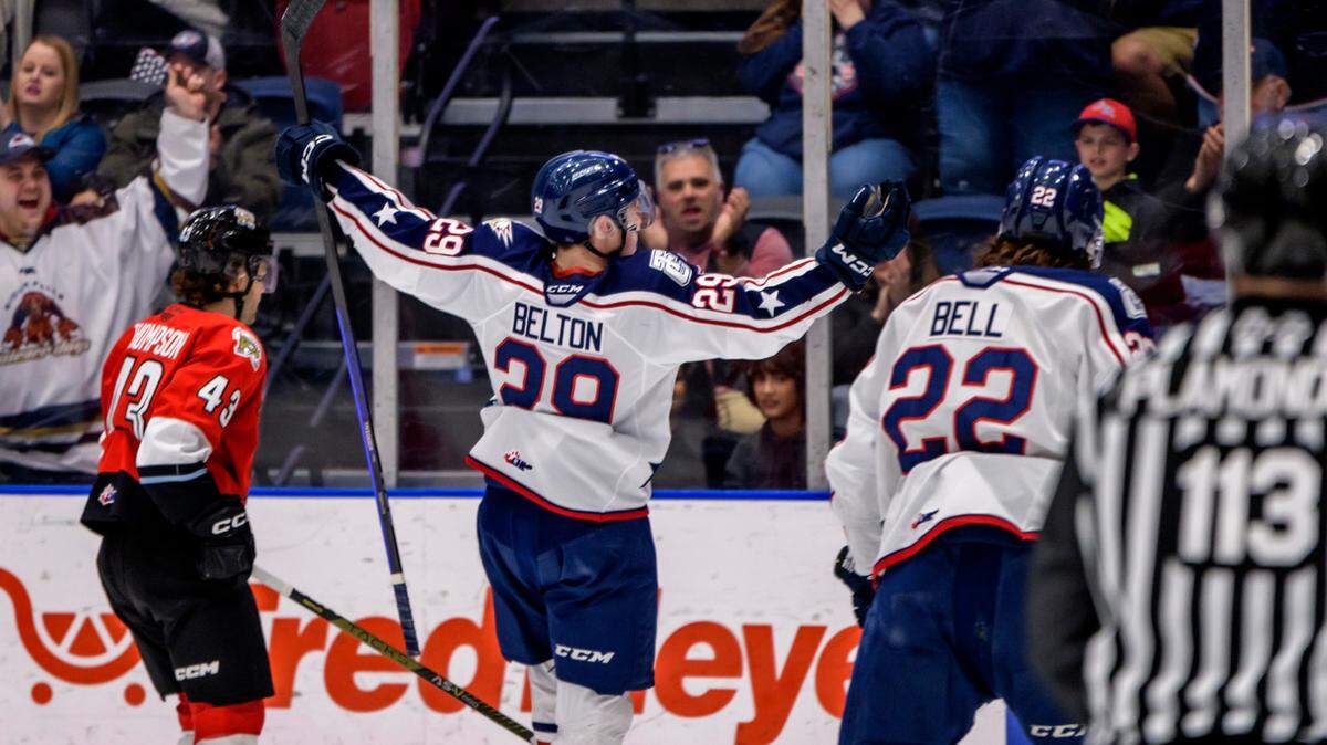 Tri-City Americans Reese Belton (29) and Parker Bell (22) join an on ice celebration during 2022-23 season.